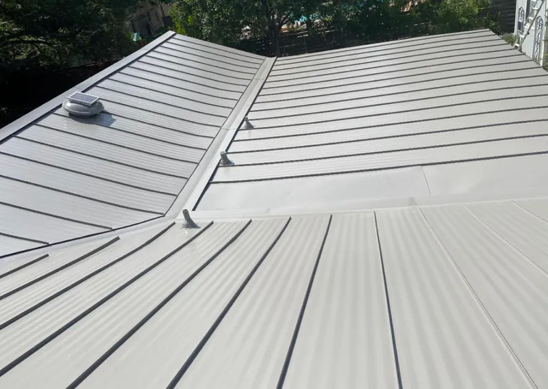Solar attic fan installed on a metal roof for Roof Ventilation in Tallahassee